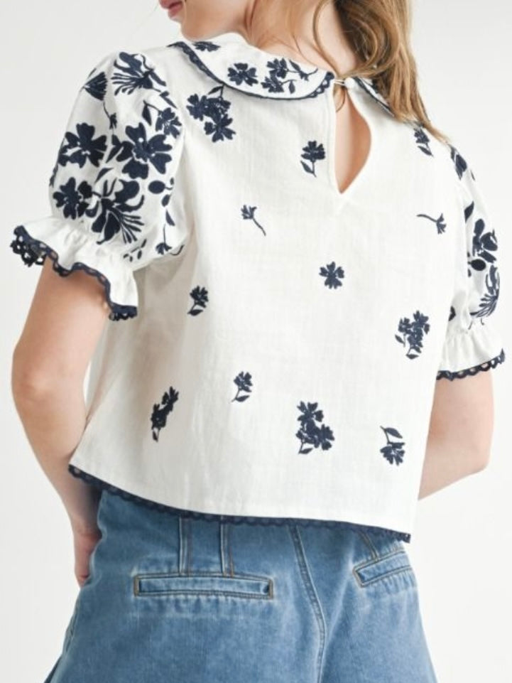 White and black embroidered floral top