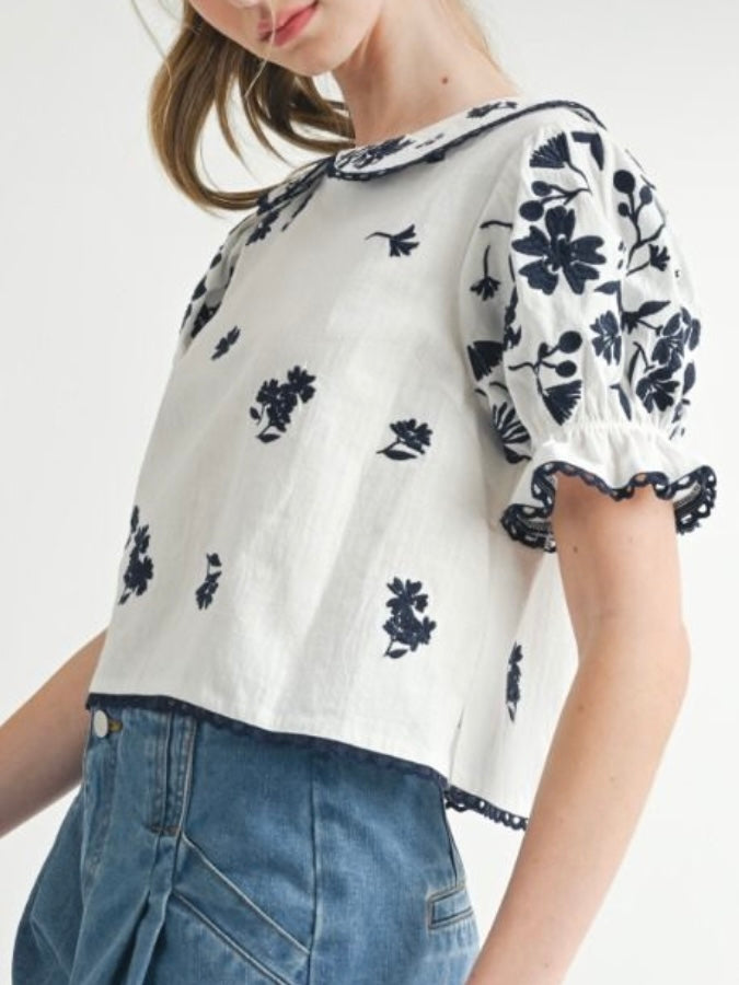 White and black embroidered floral top