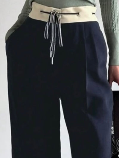 White waist band blue pants