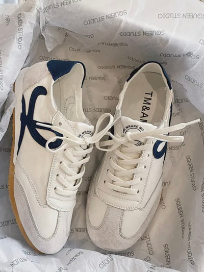 White and navy blue low sneakers shoes
