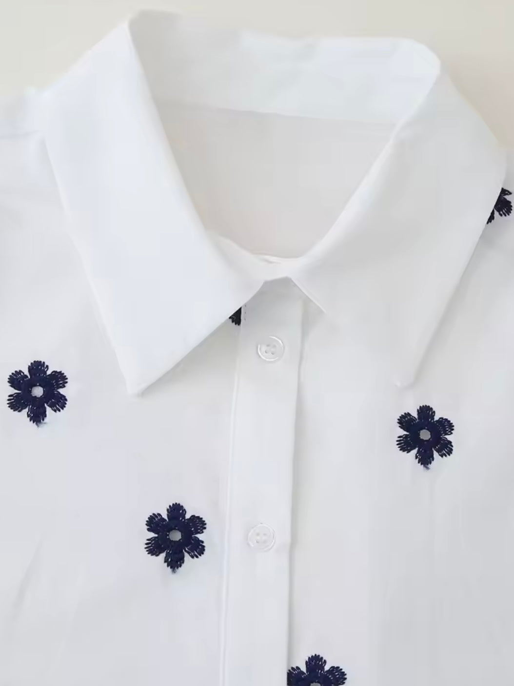 White and black embroidered floral shirt