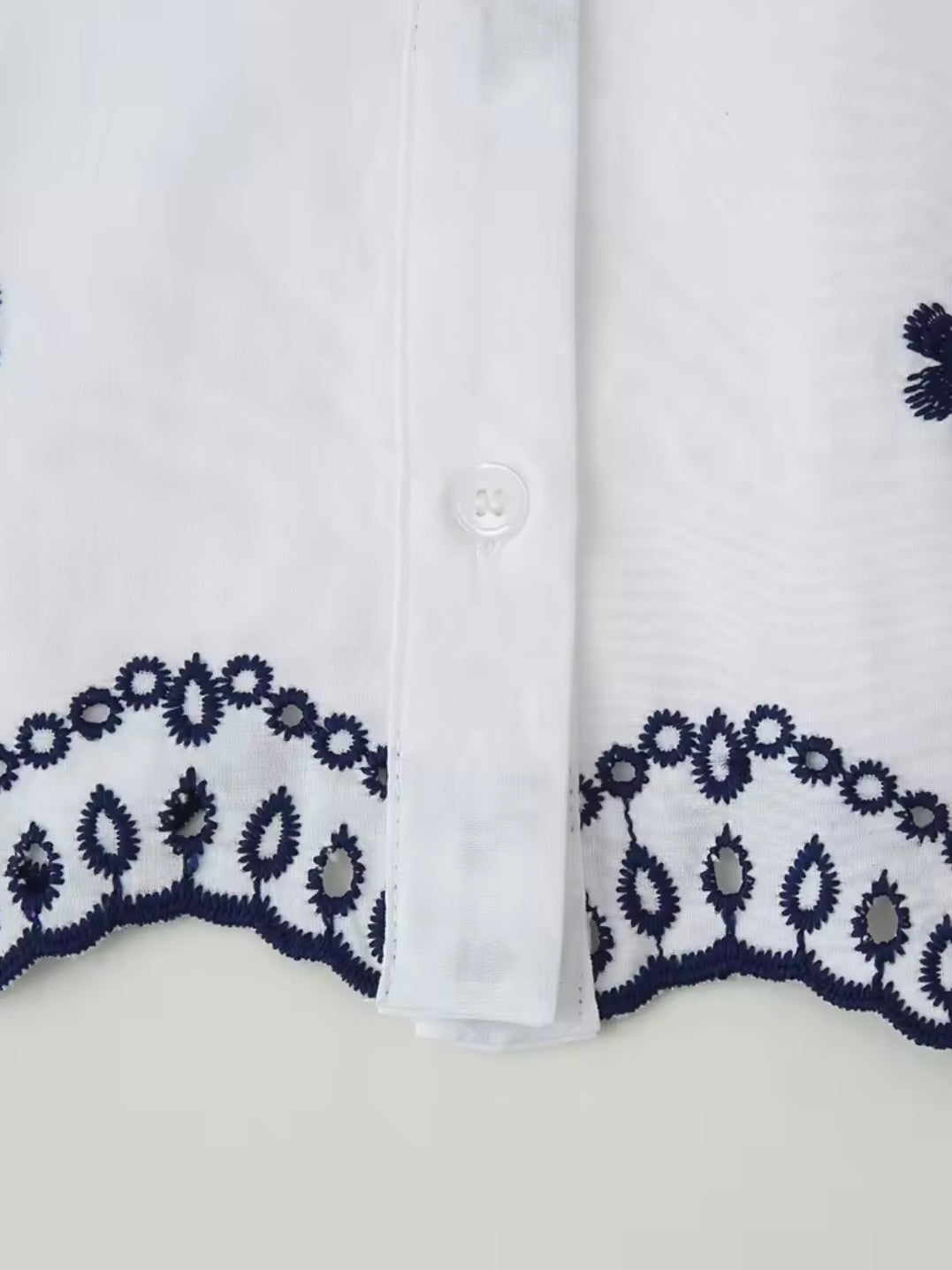 White and black embroidered floral shirt