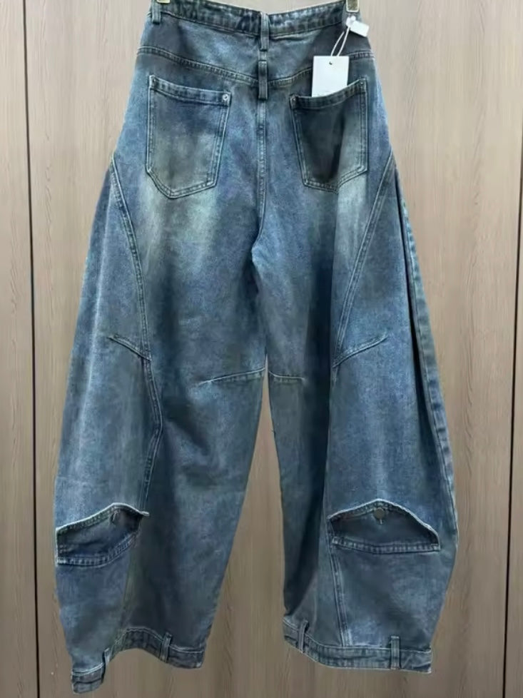 Blue jeans wide crossed destroyed details