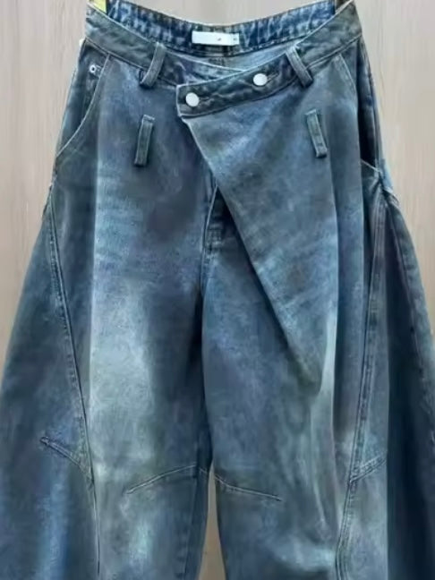 Blue jeans wide crossed destroyed details
