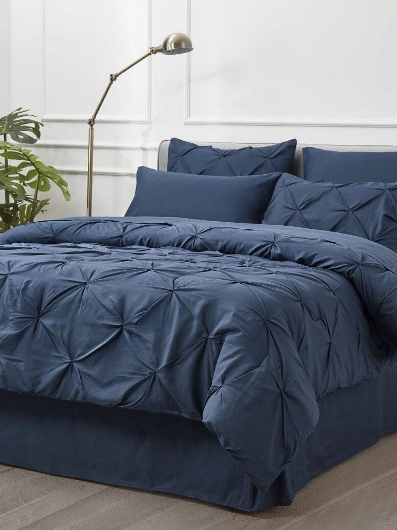 8-piece blue pleated bedding set with reversible decorative design