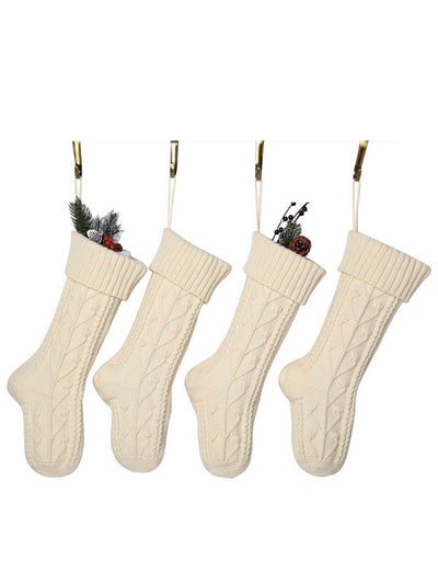 four knitting wool Christmas socks in beige