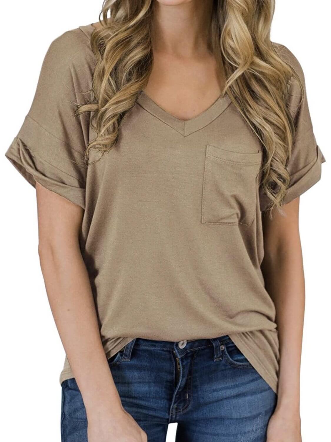 The model is wearing a camel boho-style shirt, gathered short sleeves, a V-neck and a front pocket.