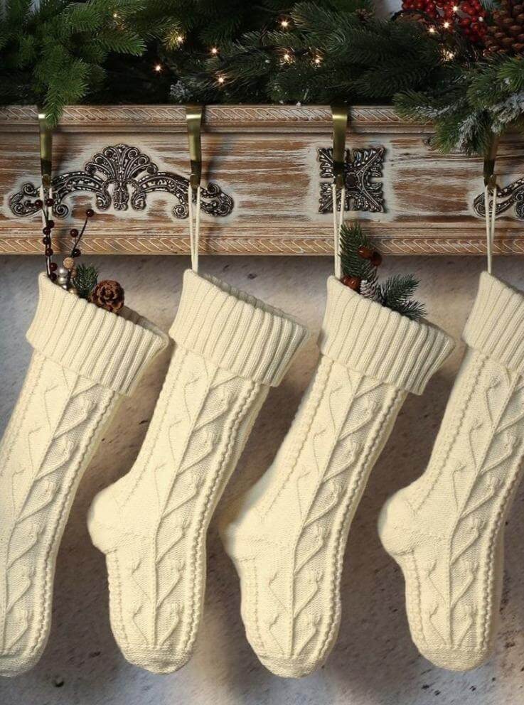 decoration with knitting wool Christmas socks in beige